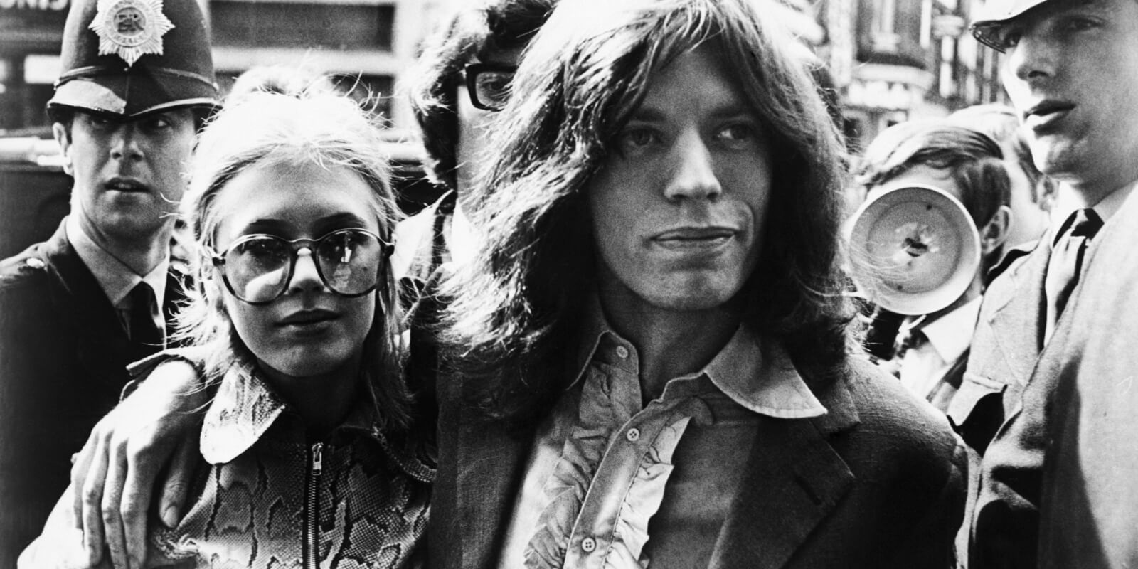Marianne Faithfull and Mick Jagger arrive at Magistrate's Court early May 29 to face charges of possessing marijuana in 1969.