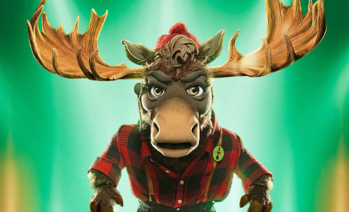 The light green poster for Moose, dressed in a lumberjack costume, on The Masked Singer Season 9