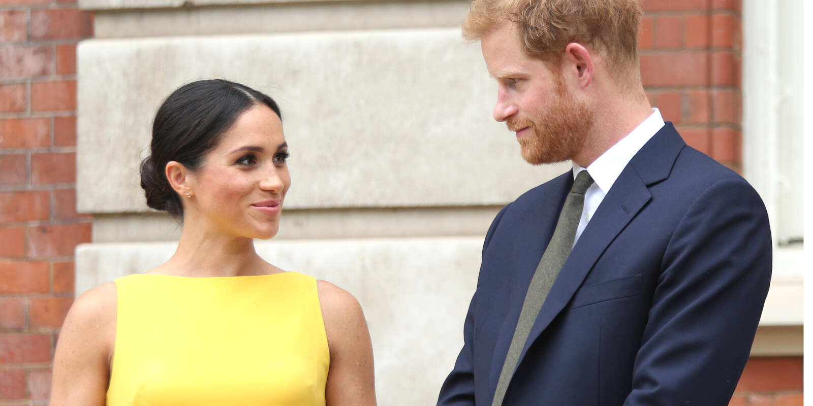 Meghan Markle and Prince Harry photographed in 2018, defended the use of their children's royal titles as their 'birthright.'