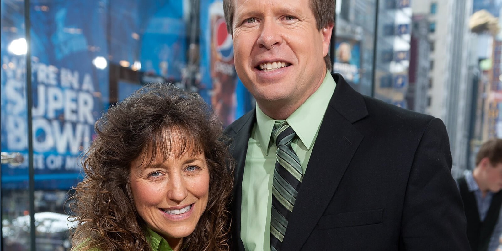 Michelle and Jim Bob Duggar pose during an appearance on the television show 'Extra.'