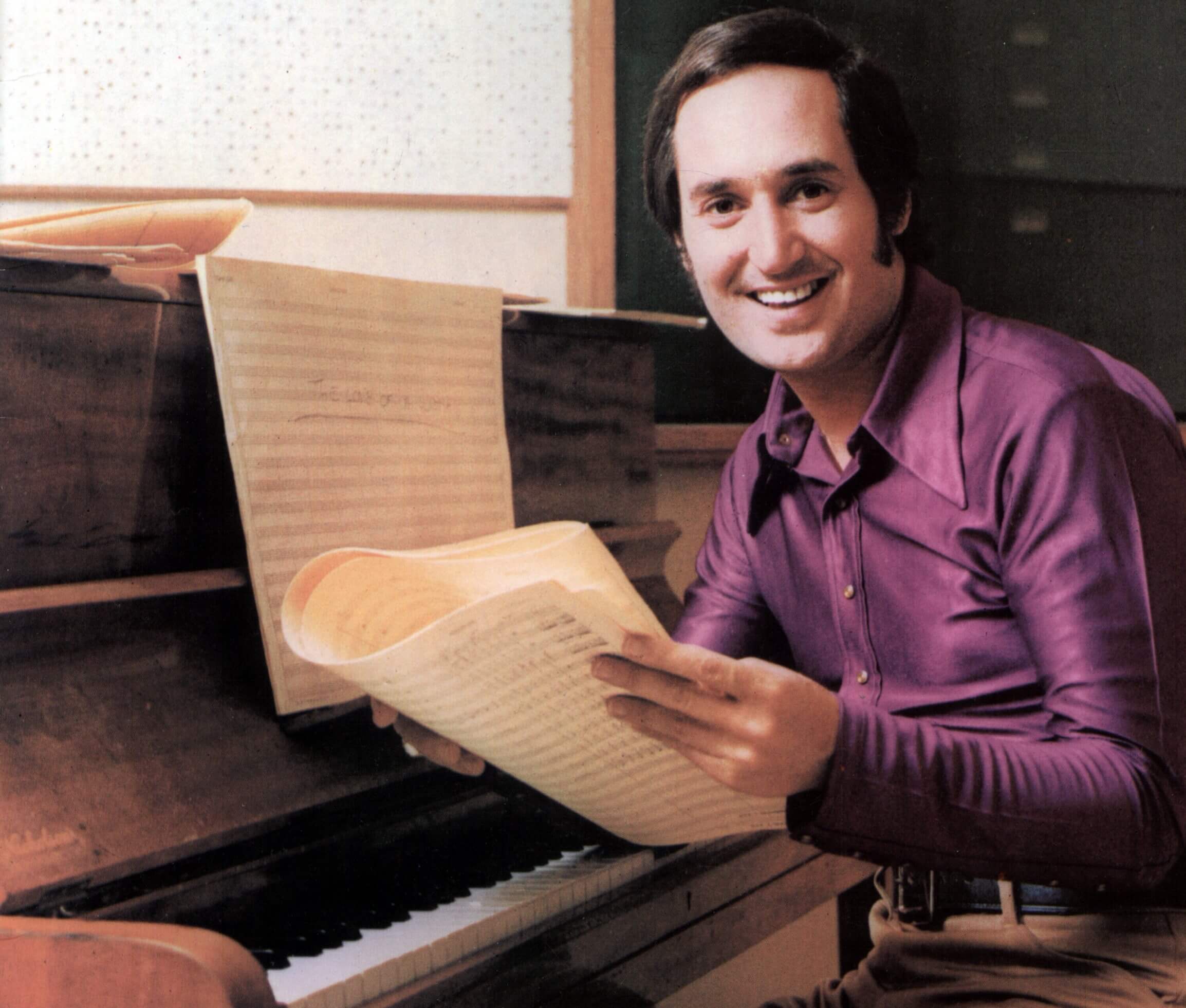 Neil Sedaka, writer of a few Monkees songs, at a piano