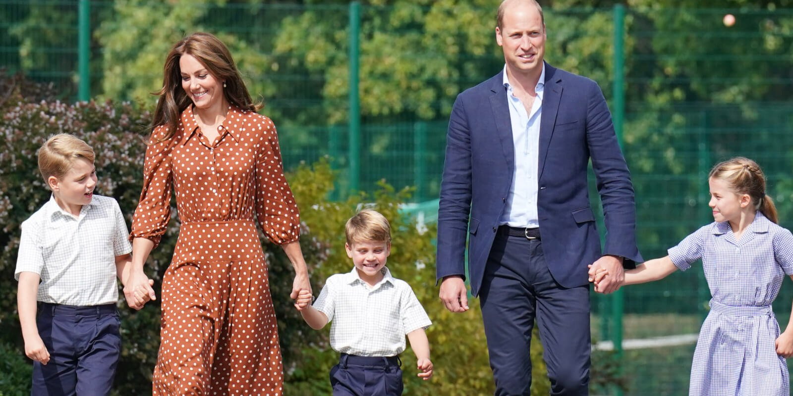Prince George, Kate Middleton, Prince Louis, Prince William and Princess Charlotte walk as a family to school.