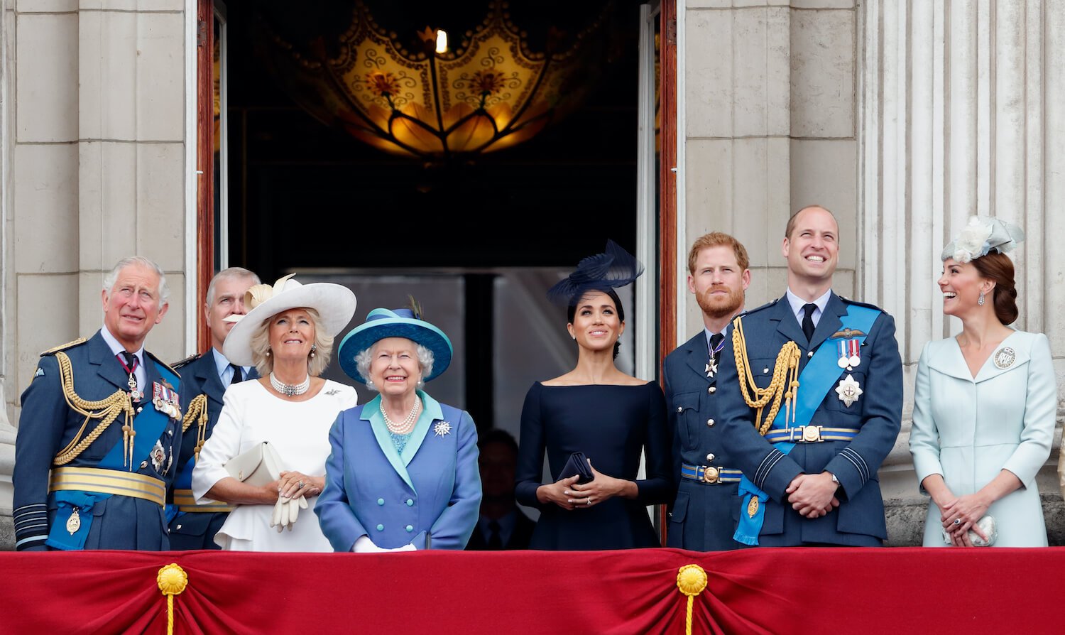 Prince Harry and Meghan Markle stand with members of the royal family on the balcony of Buckingham Palace