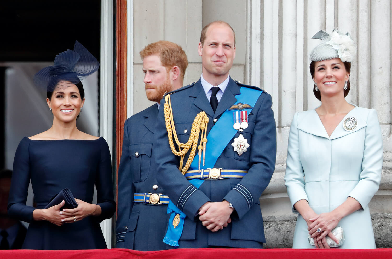 Meghan Markle and Prince Harry stand with Prince William and Kate Middleton on the Buckingham Palace balcony