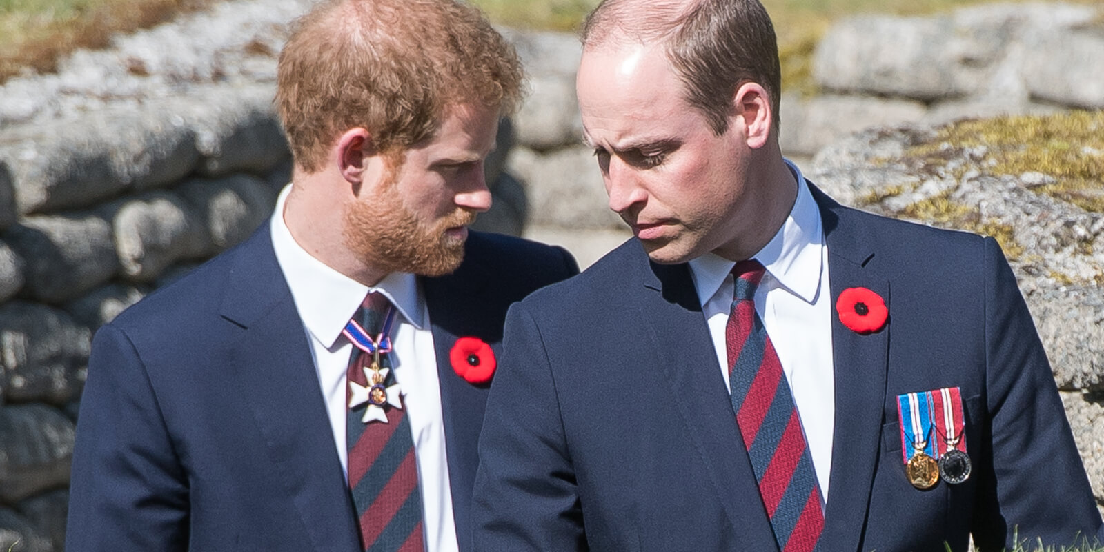 Prince William, Duke of Cambridge and Prince Harry walk through a trench during the commemorations for the 100th anniversary of the battle of Vimy Ridge on April 9, 2017 in Lille, France.