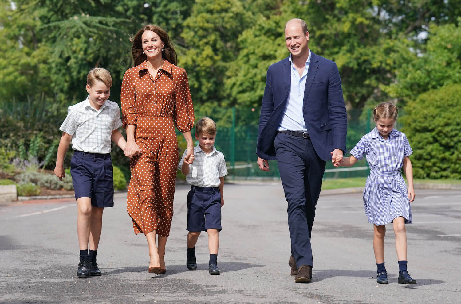 Prince William and Kate Middleton walk with their children to school
