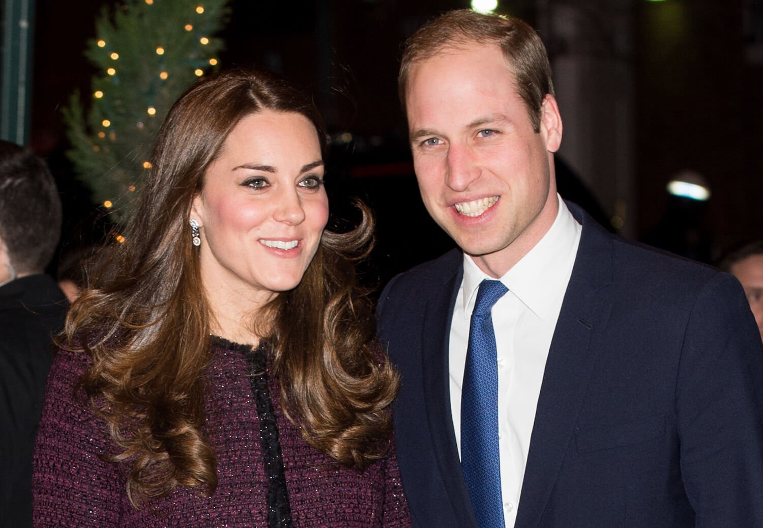 Kate Middleton and Prince William smile while standing together