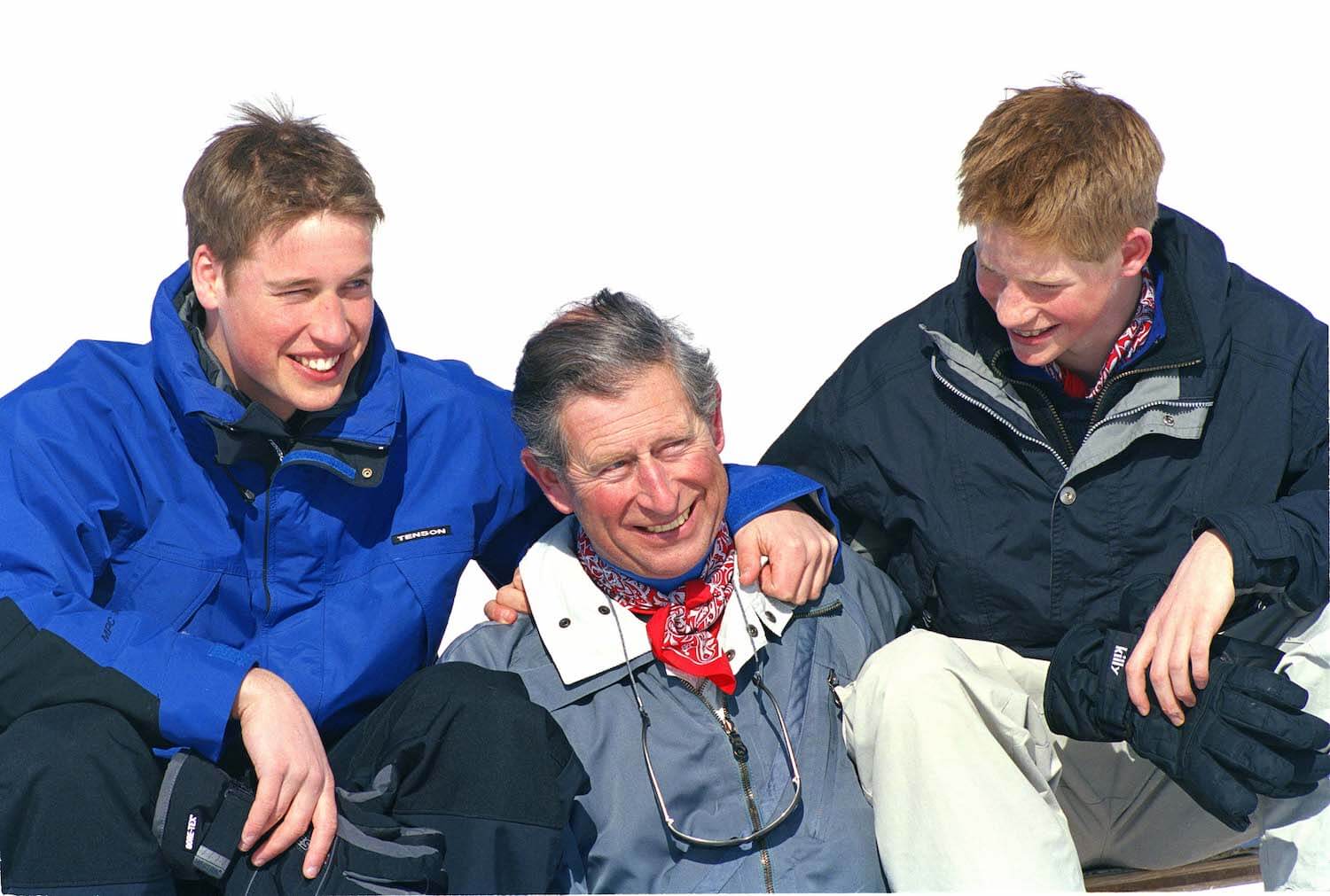 Prince William, King Charles and Prince Harry dressed in winter clothes while on a ski trip