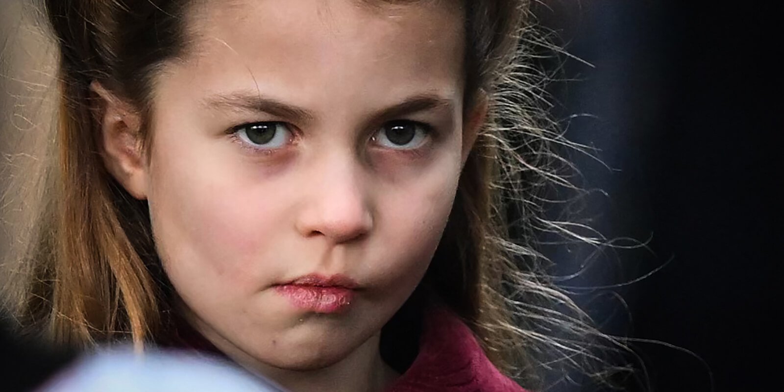 Princess Charlotte makes a face at photographers during Christmas 2022.