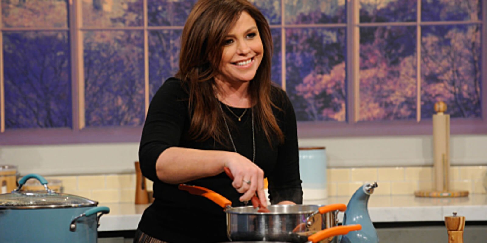 Rachael Ray cooking on the set of her syndicated talk show.