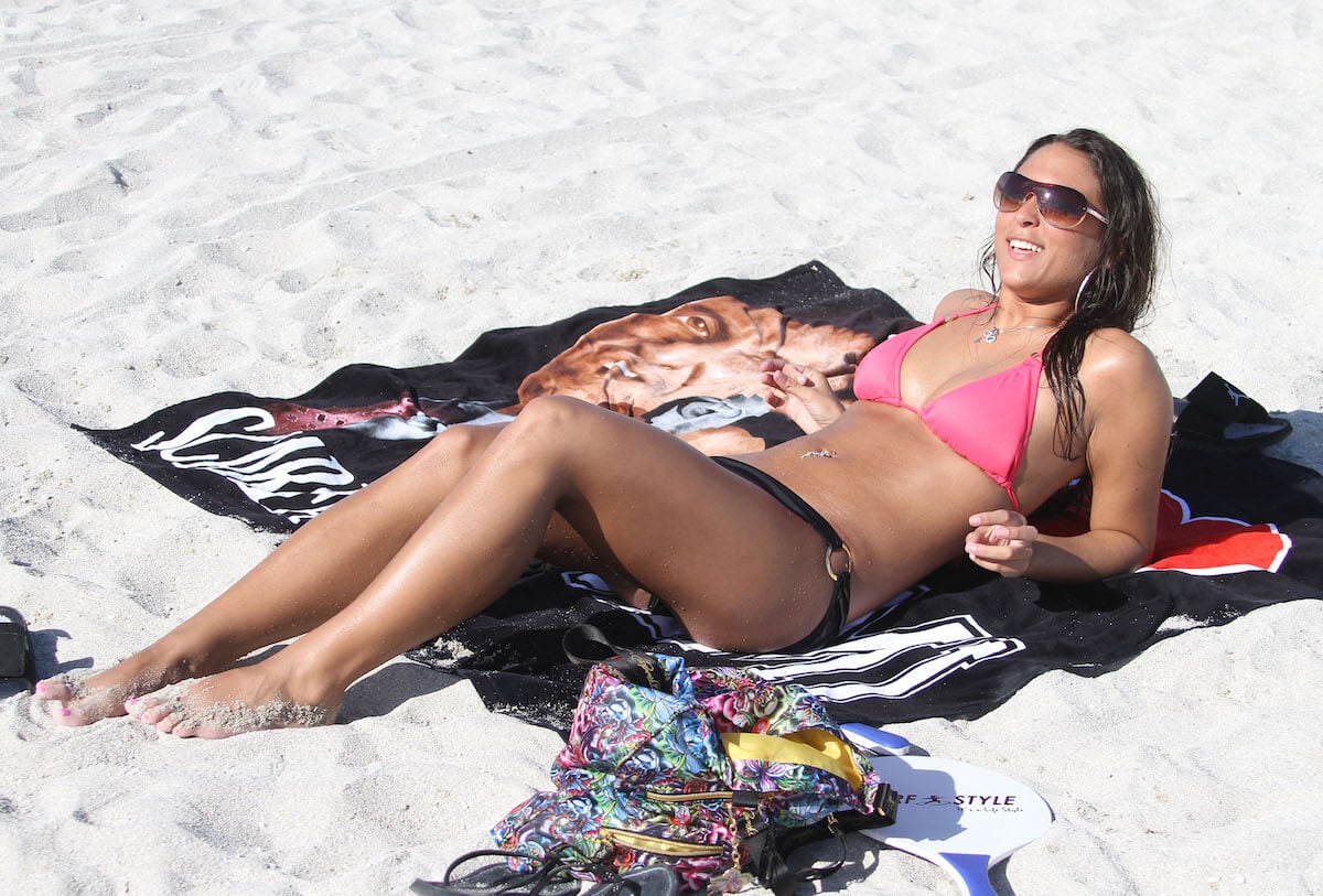 Sammi 'Sweetheart' Giancola, who gave us many quotes during her time on 'Jersey Shore,' laying on the beach in 2010.