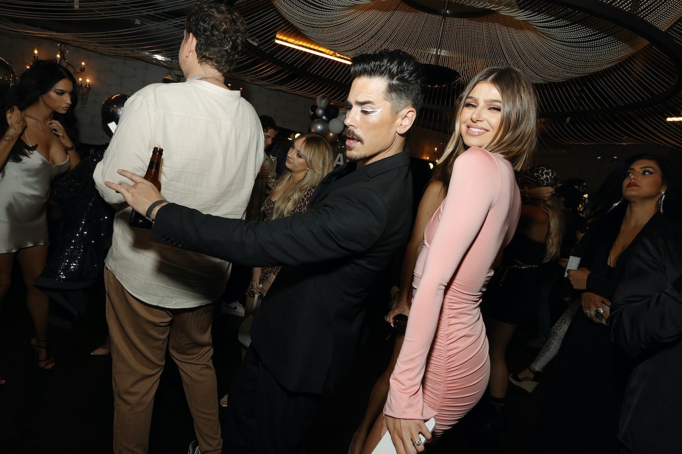 Tom Sandoval and Raquel Leviss from 'Vanderpump Rules' dance at a party