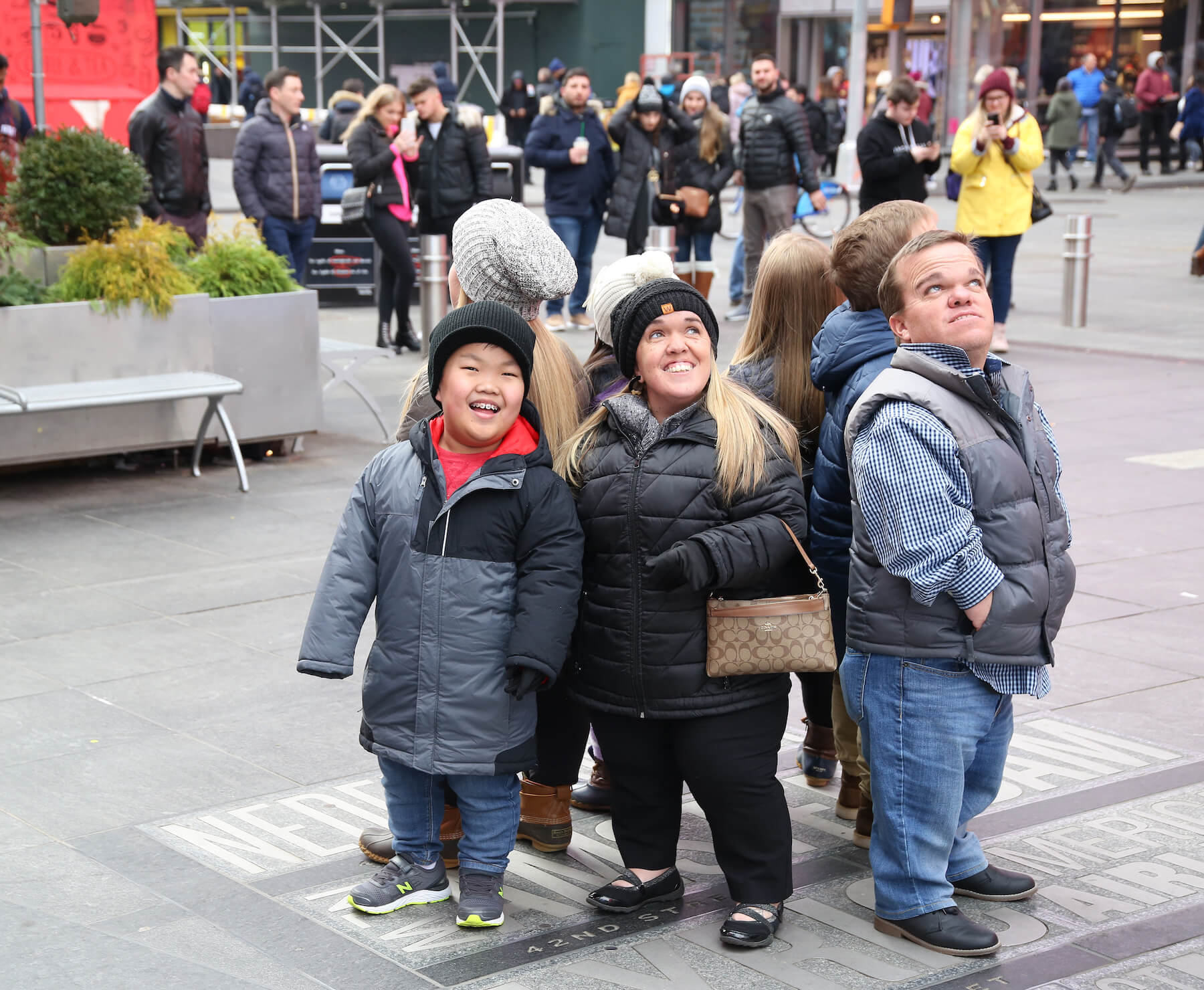 '7 Little Johnstons' cast standing together on the streets of a city