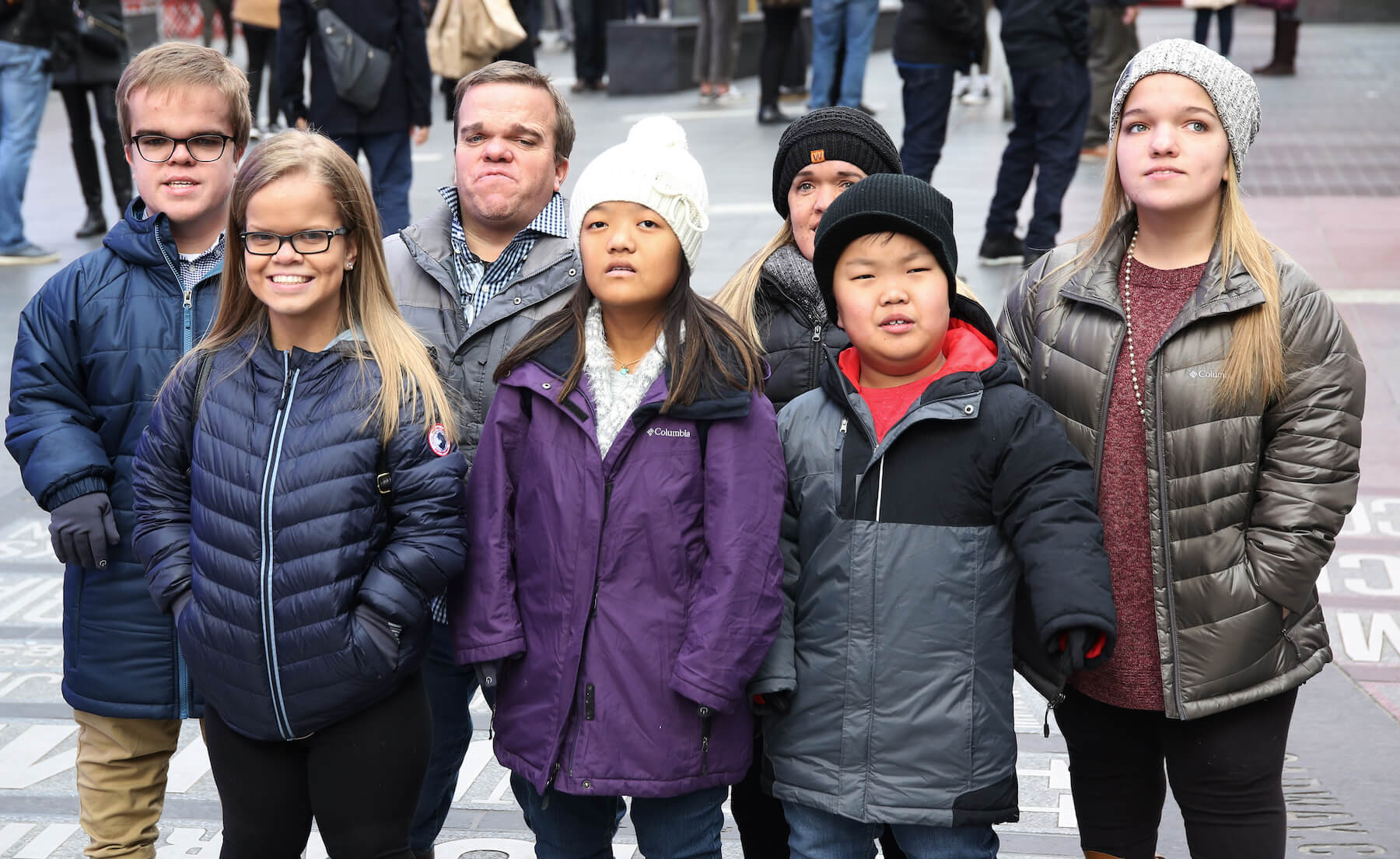 The '7 Little Johnstons' cast standing together outside in cold weather