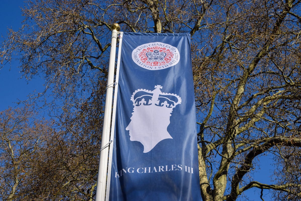 A banner for the coronation, which Meghan Markle isn't attending in a 'huge relief'