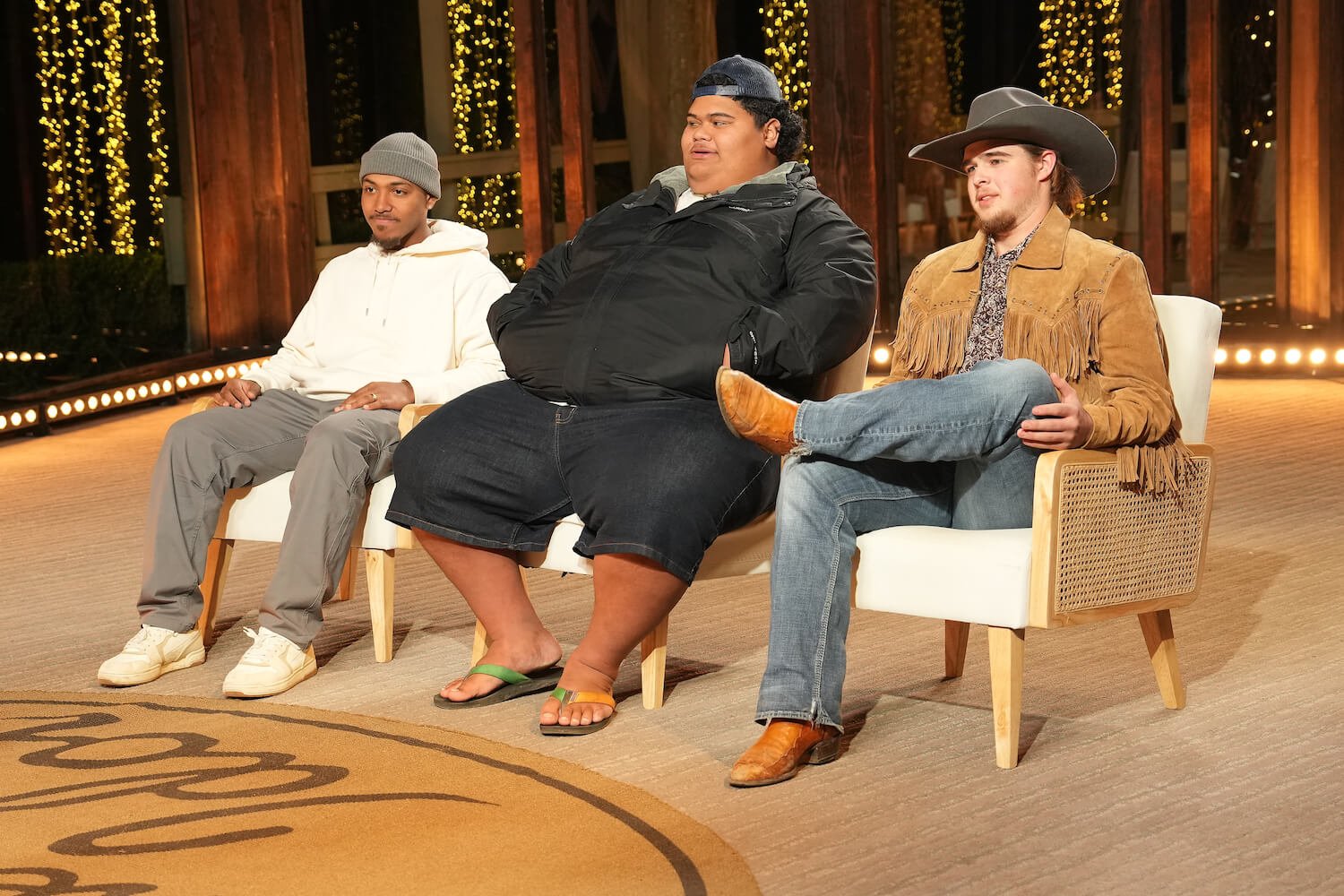 'American Idol' 2023 contestants Matt Wilson, Iam Tongi, and Colin Stough sitting next to each other. 'American Idol' 2023 spoilers note they sing in a trio.