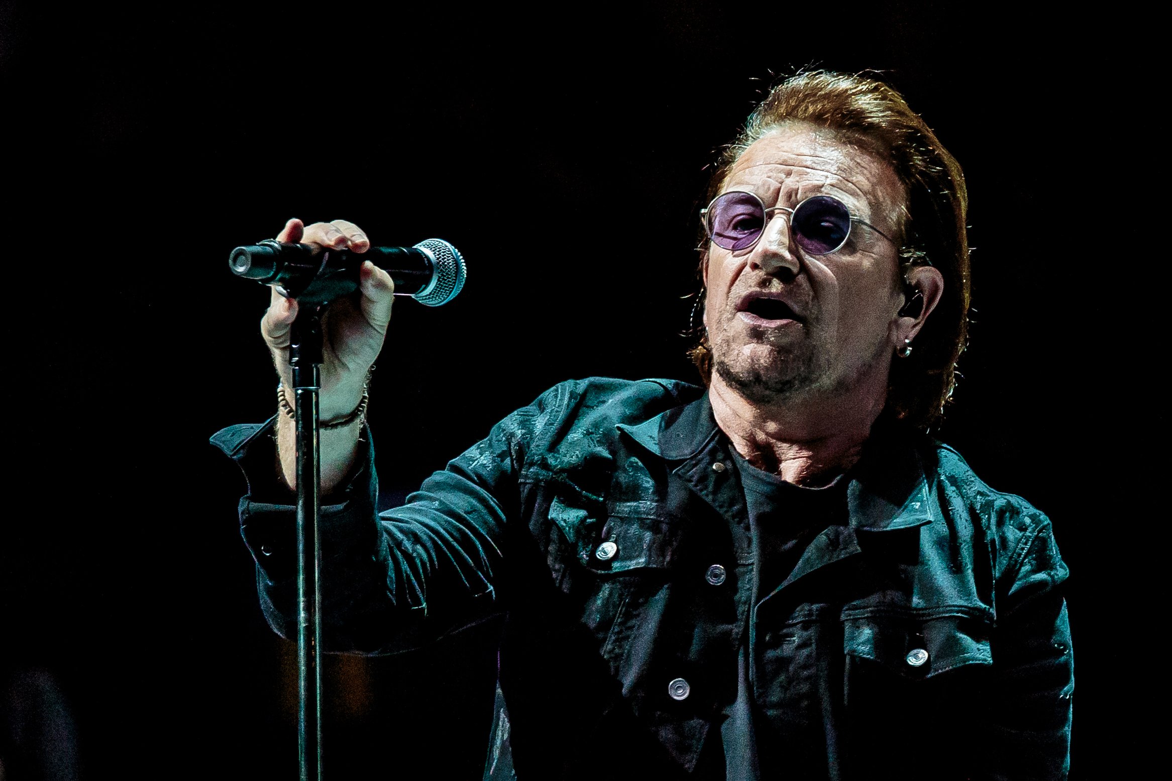 Bono performs with U2 in Milan, Italy