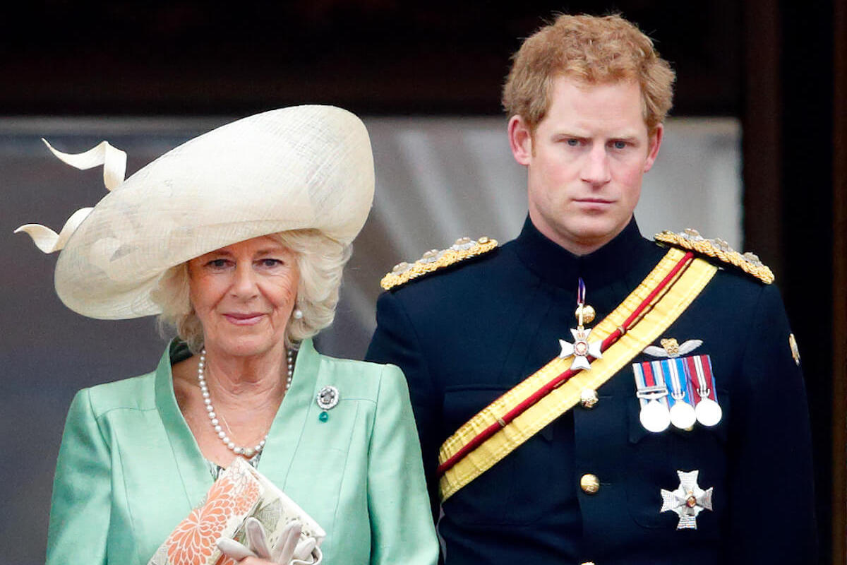 Camilla Parker Bowles, whose reaction to 'Spare' included an 'eye-roll,' stands with Prince Harry