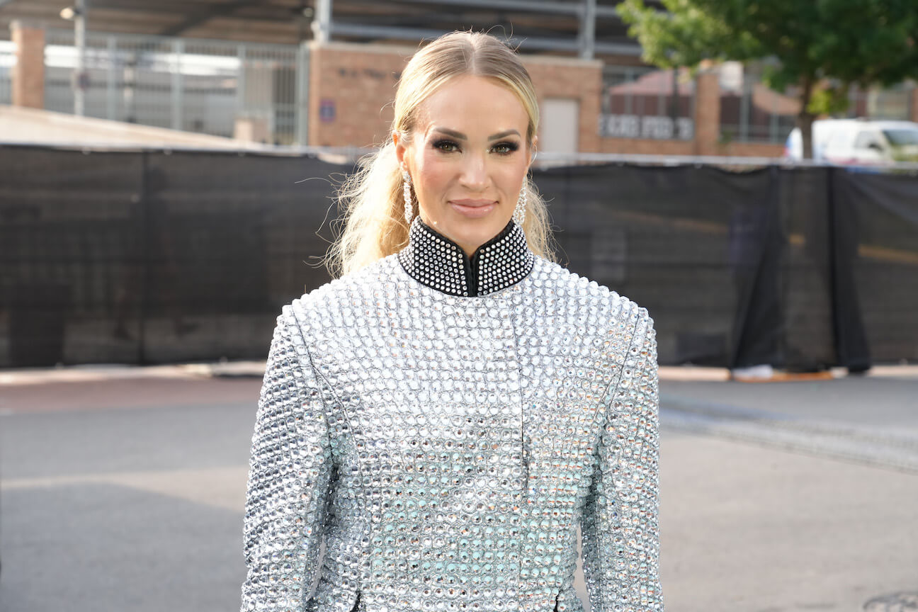 Carrie Underwood smiling and wearing a rhinestone outfit at the CMT Music Awards. Carrie Underwood has won numerous CMT Music Awards.