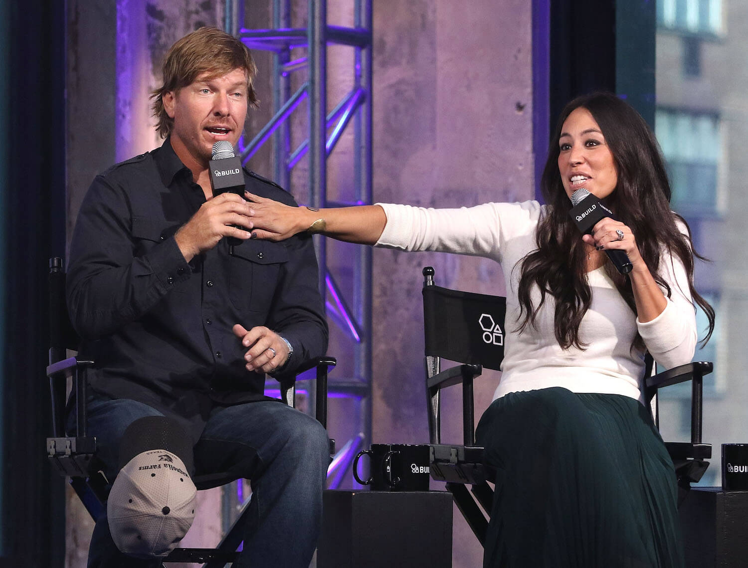 Chip and Joanna Gaines from 'Fixer Upper' sitting next to each other for an interview