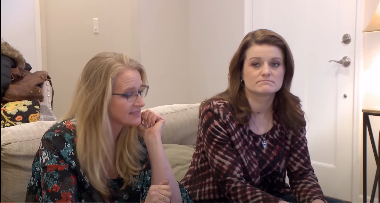 Christine Brown and Robyn Brown sit next to each other during Kody's house presentation on an episode of 'Sister Wives'
