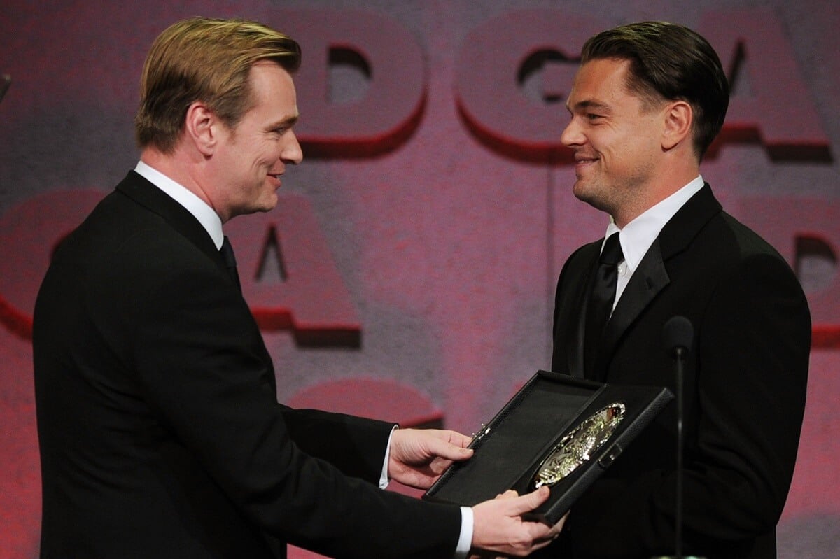 Christopher Nolan accepting an award from Leonardo DiCaprio.