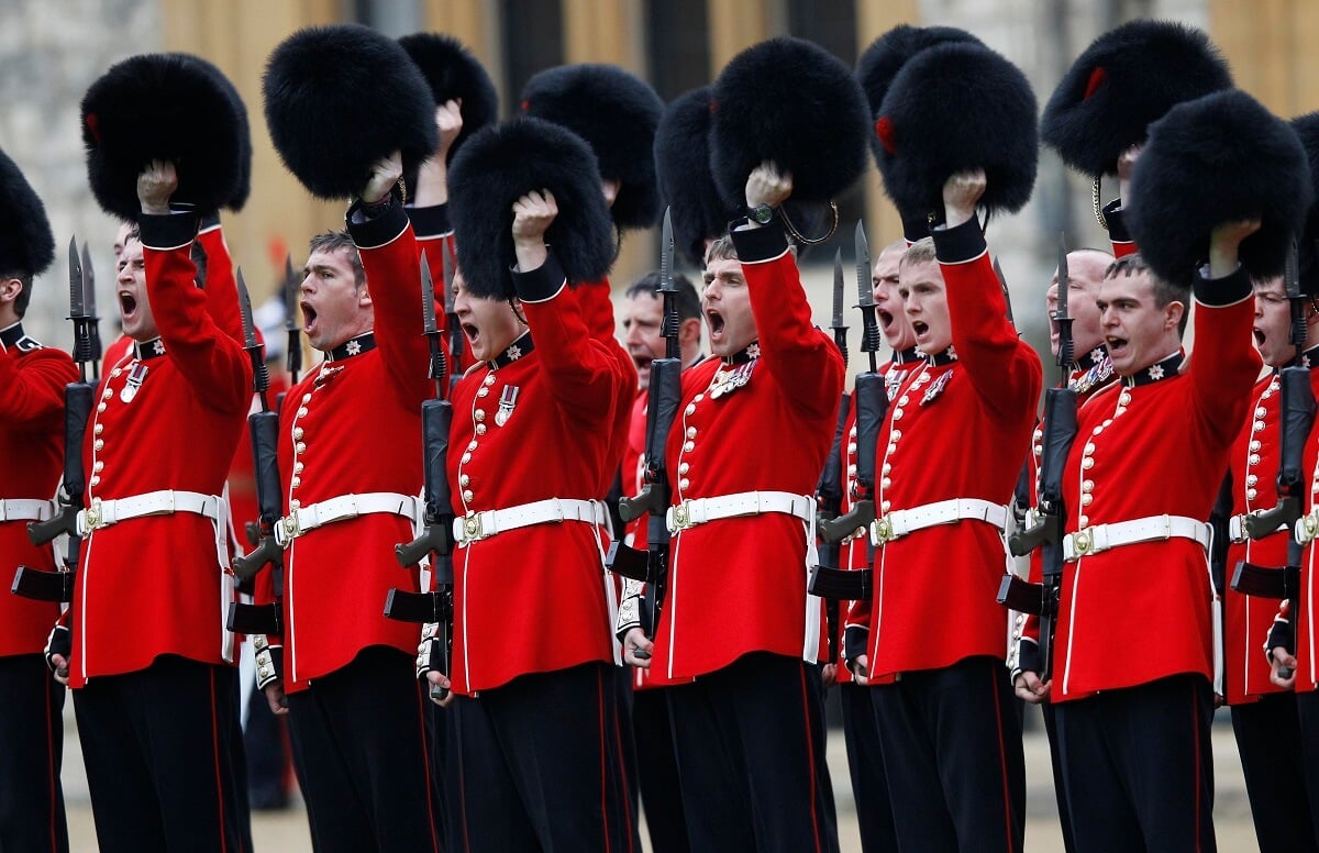 Coldstream Guards raise their bearskins after being presented with their new colors Windsor Castle