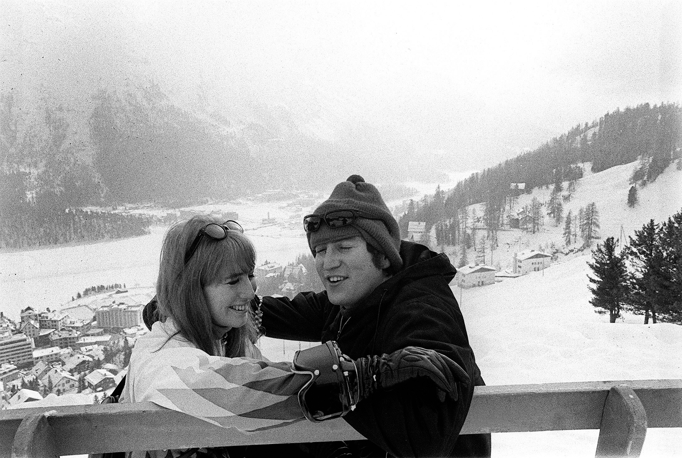 Cynthia and John Lennon laughing in the snow.