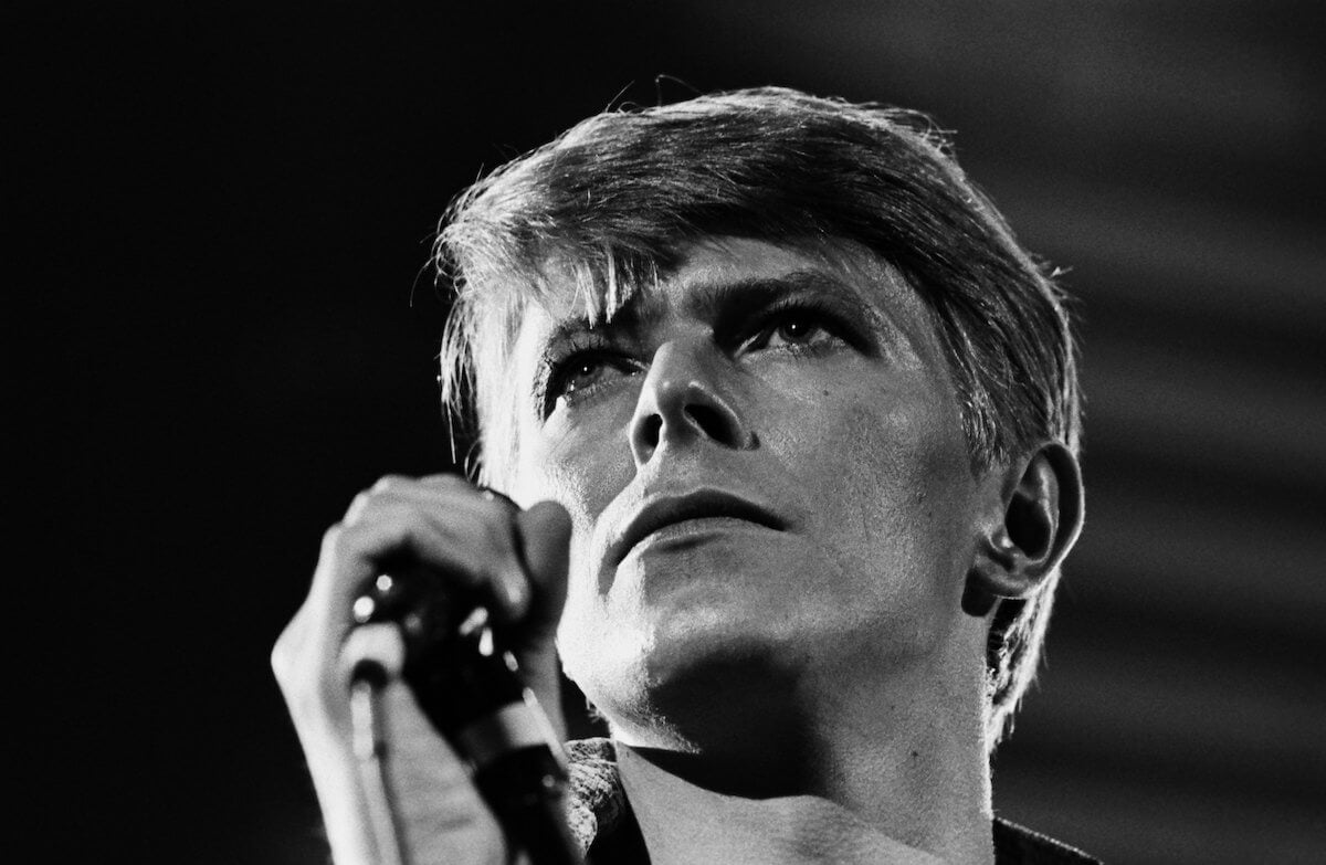 Closeup of David Bowie holding a microphone