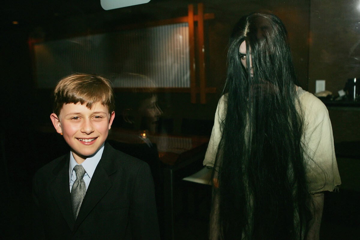 Actor David Dorfman standing with the 'dead girl' from 'The Ring'