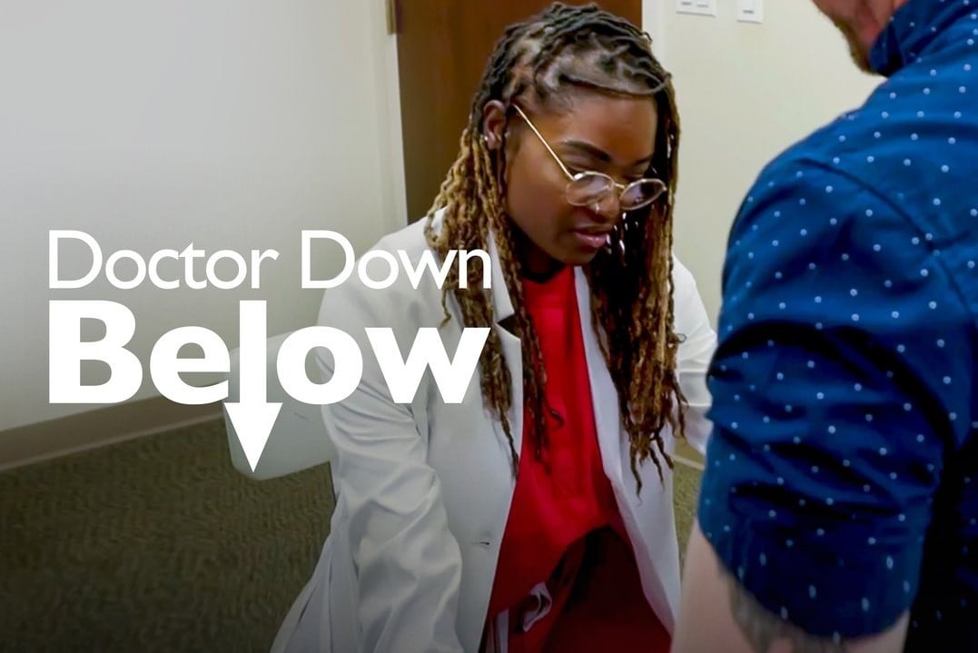 Dr. Fenwa Milhouse, the star of 'Dr. Down Below' on TLC, wears a white doctors coat over a red shirt.