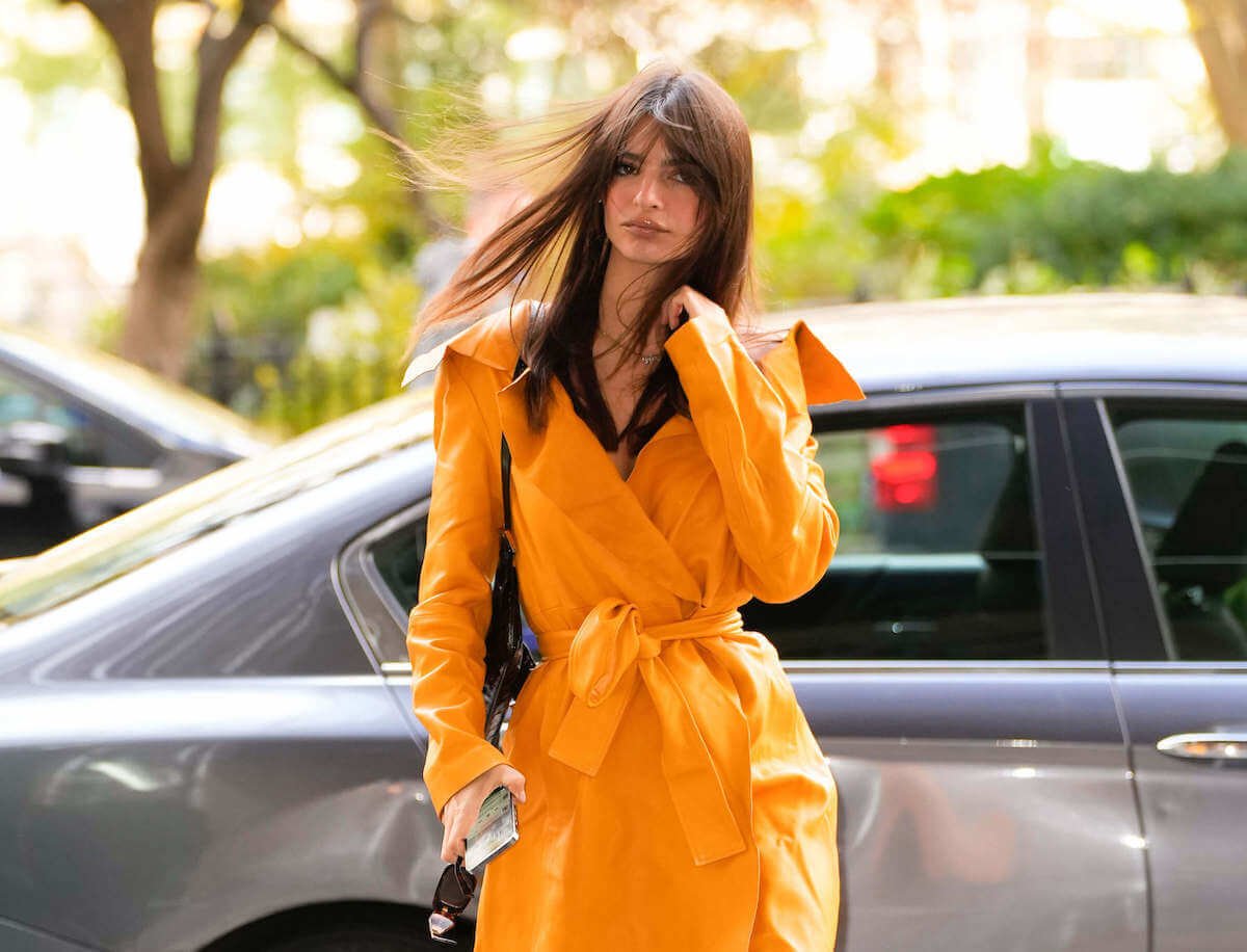 Emily Ratajkowski in a yellow coat