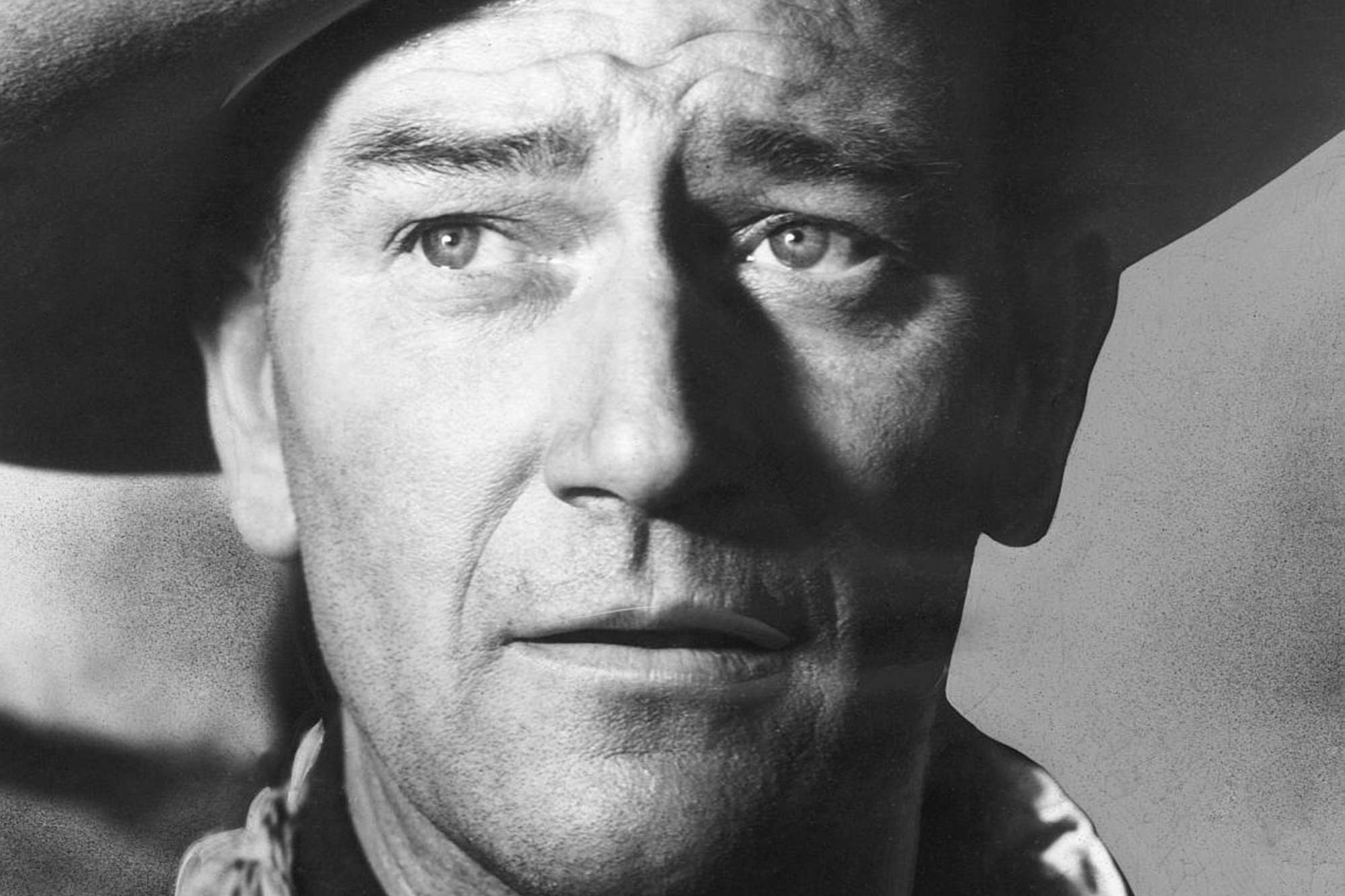 'Fort Apache' John Wayne as Capt. Kirby York wearing a cowboy hat, looking up.