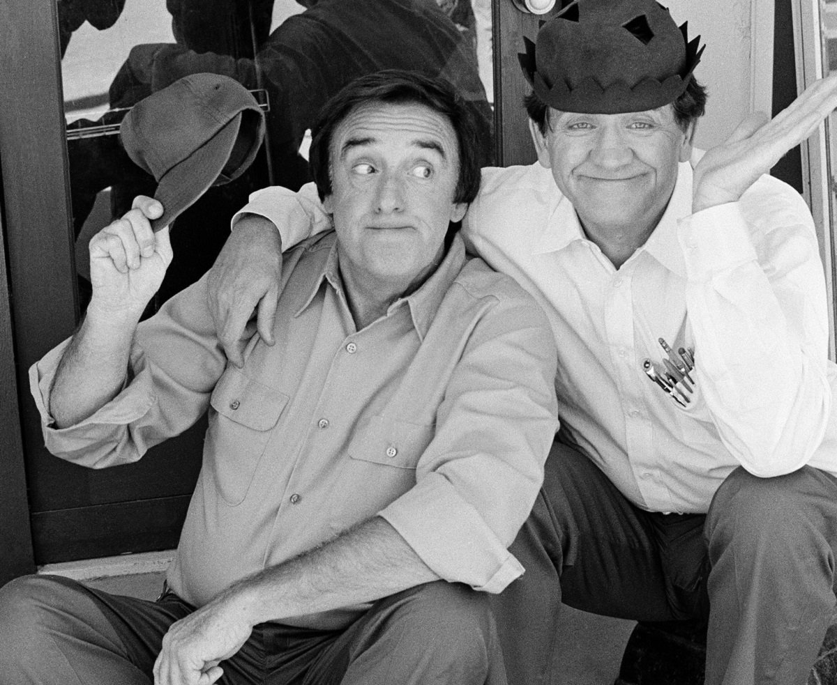 Jim Nabors and George Lindsay, both in button down shirts, sit together on the set of 'Return to Mayberry' The TV movie remains beloved.