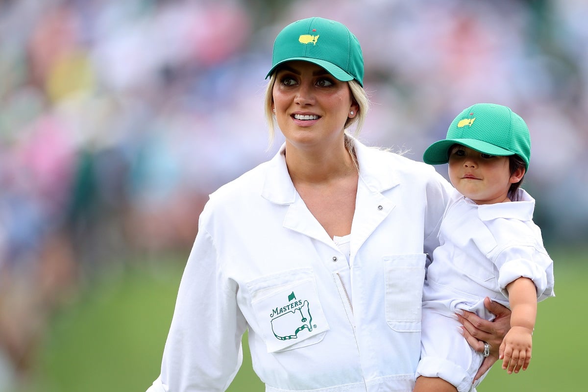 Jason Day's wife Ellie Day holds son, Oz Nilo, prior to the 2023 Masters Tournament