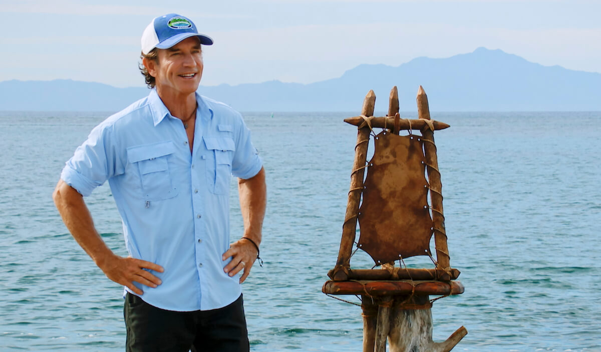 Jeff Probst with his hands on his hips and smiling