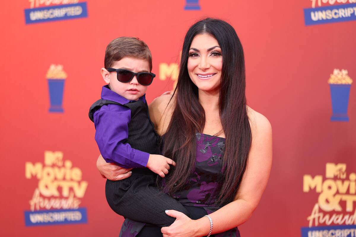 Christopher John Buckner and Deena Nicole Cortese attend the 2022 MTV Movie & TV Awards