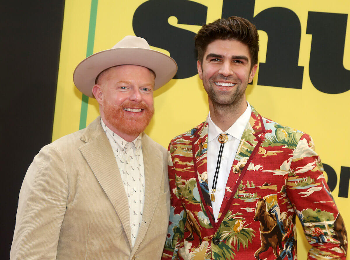 Jesse Tyler Ferguson and Justin Mikita smiling