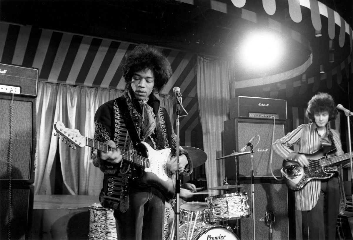 Jimi Hendrix performs onstage. 
