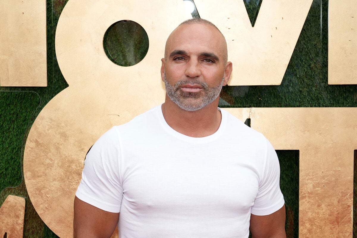 Joe Gorga in a white shirt not smiling