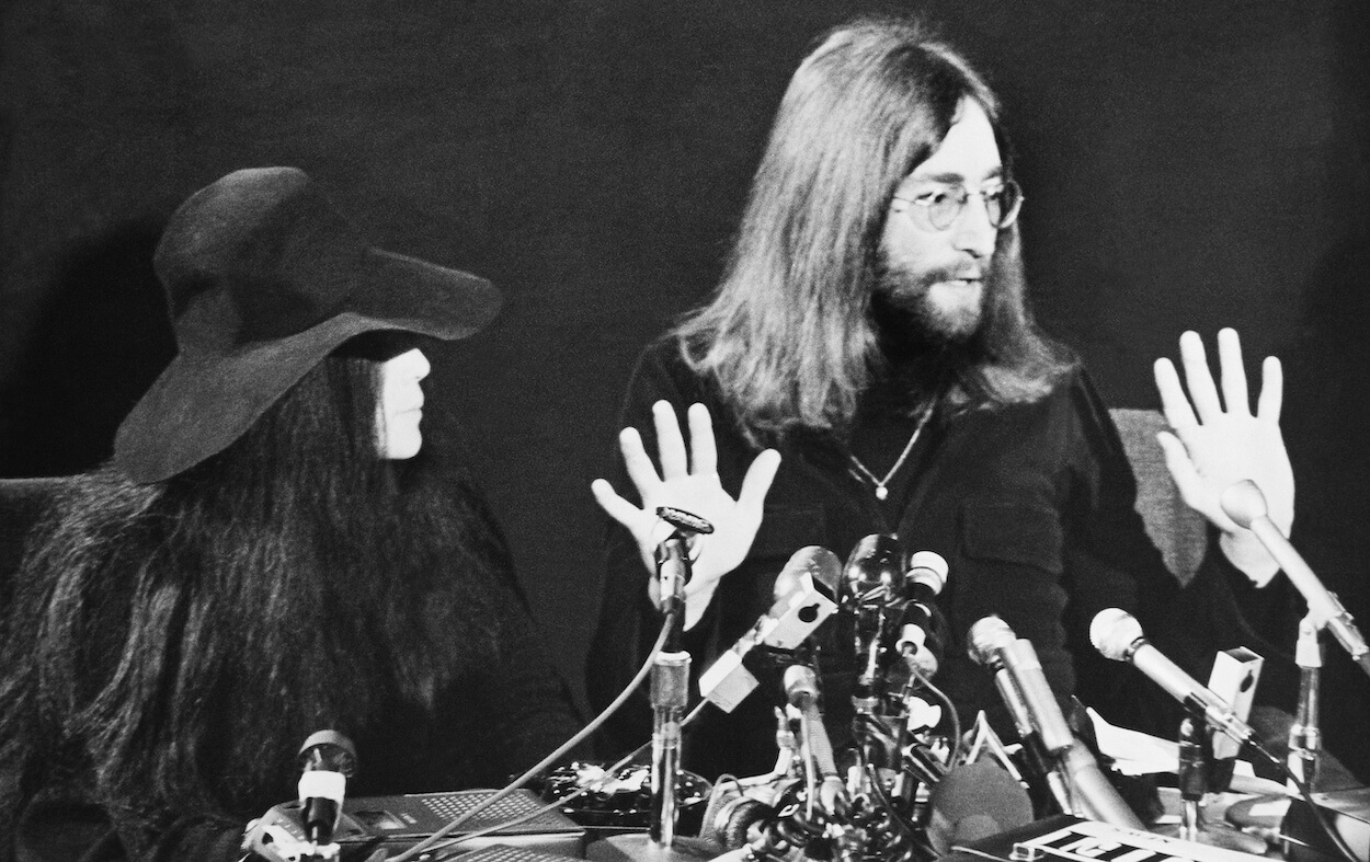 Yoko Ono (left) looks at John Lennon as he speaks during a press conference in Toronto in December 1969
