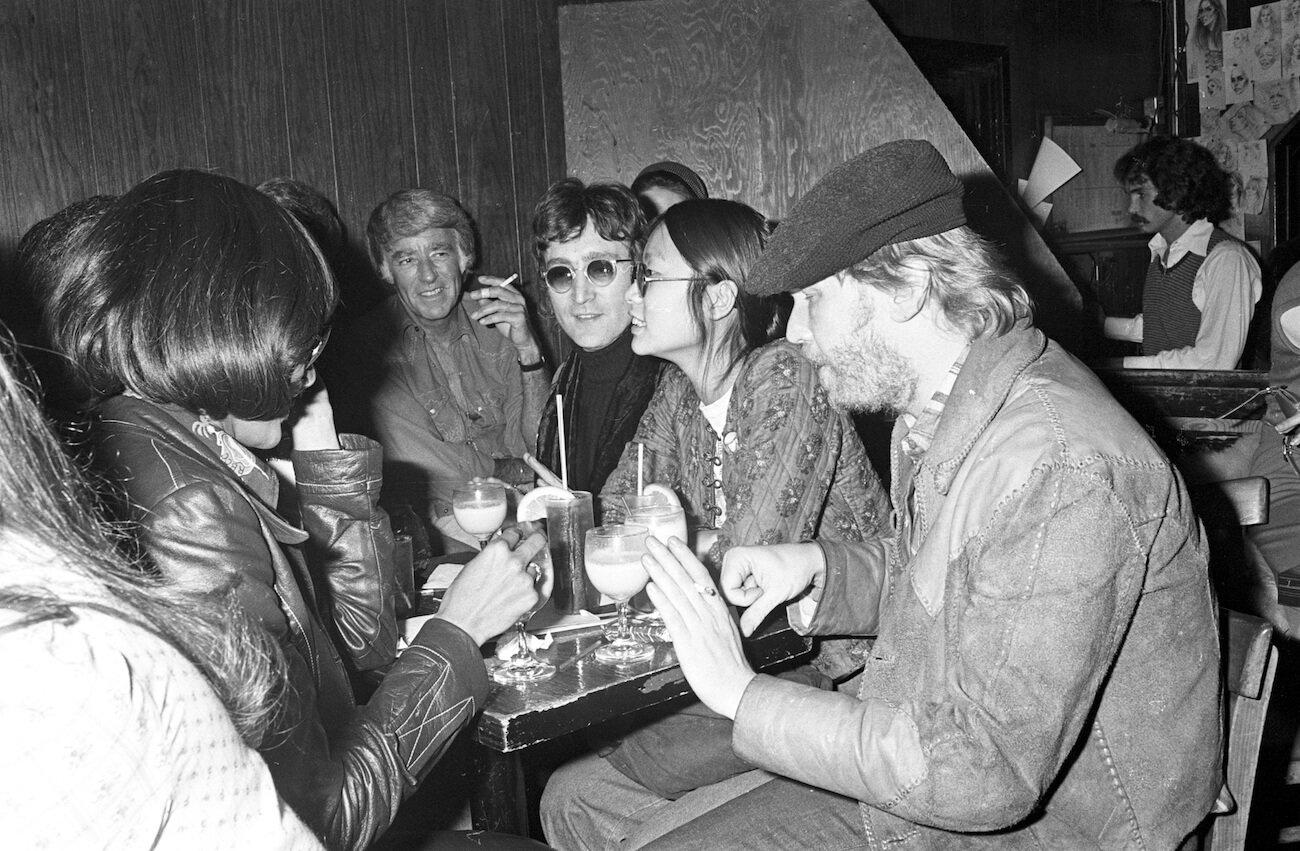 John Lennon and May Pang out with friends in Hollywood in 1974.