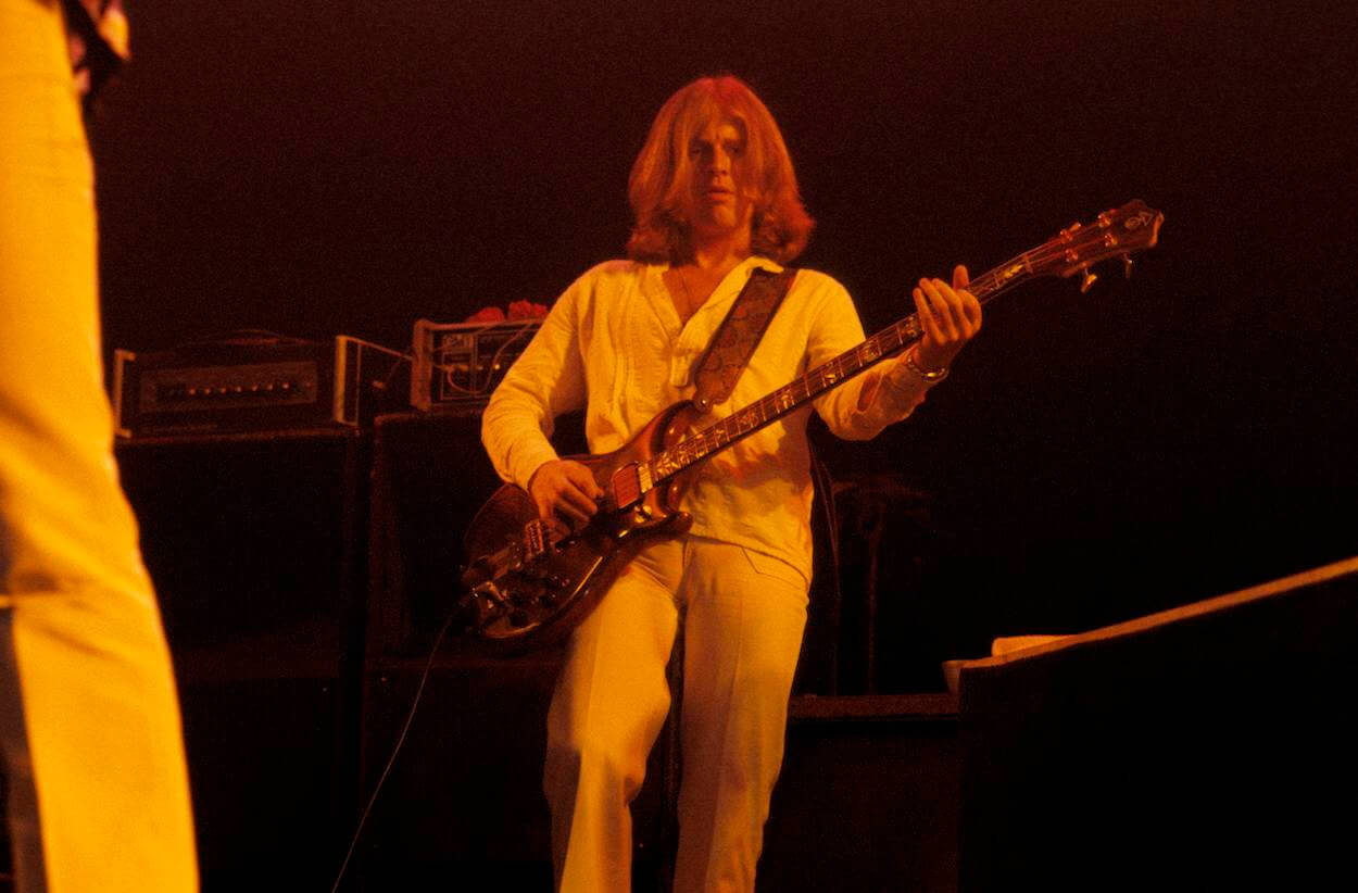 Led Zeppelin John Paul Jones wears all white while performing during a 1977 tour stop.