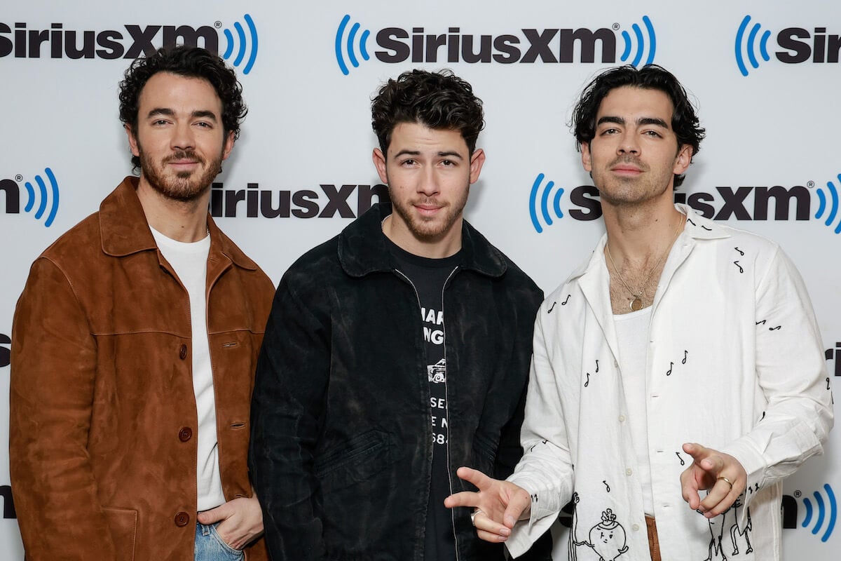 Kevin Jonas, Nick Jonas, and Joe Jonas of The Jonas Brothers smiling
