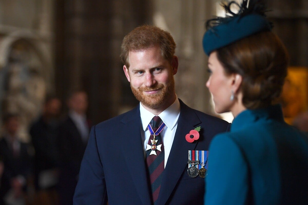 Prince Harry smiling at Kate Middleton and Prince Harry during the ANZAC Day Service of Commemoration and Thanksgiving in 2019