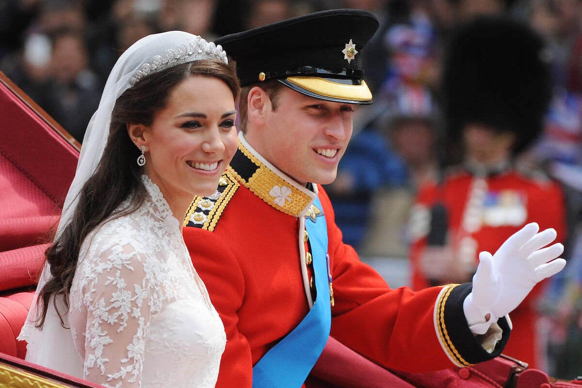 Kate Middleton and Prince William, whose royal wedding Prince Harry shared details of in 'Spare', wave and smile