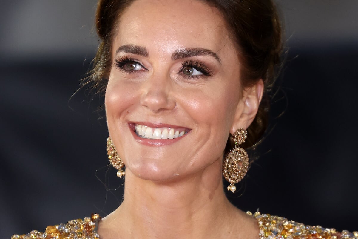 Kate Middleton wears a sequin gown in a 'film star moment' at the 'No Time to Die' premiere and smiles