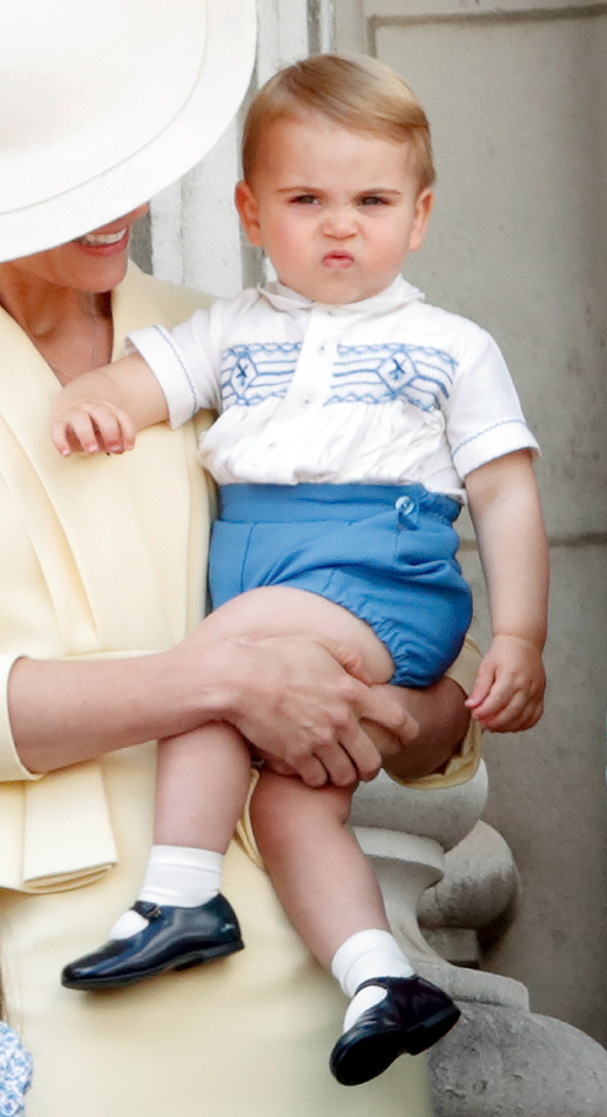 Kate Middleton holding Prince Louis on the balcony of Buckingham Palace during Trooping The Colour 2019