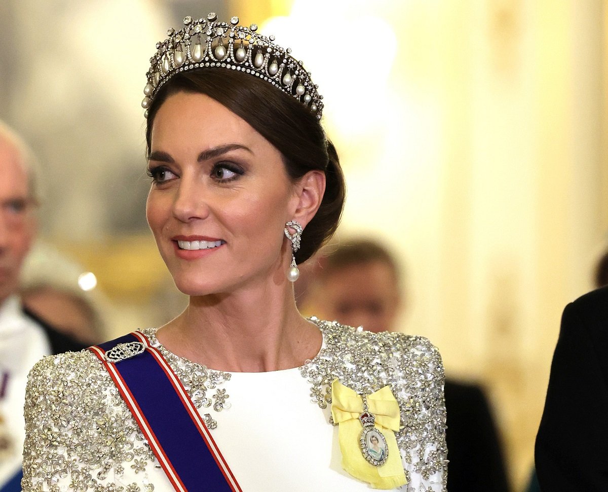 Kate Middleton, who an expert believes will pay tribute to Kate Middleton with her coronation dress, pictured during the State Banquet at Buckingham Palace