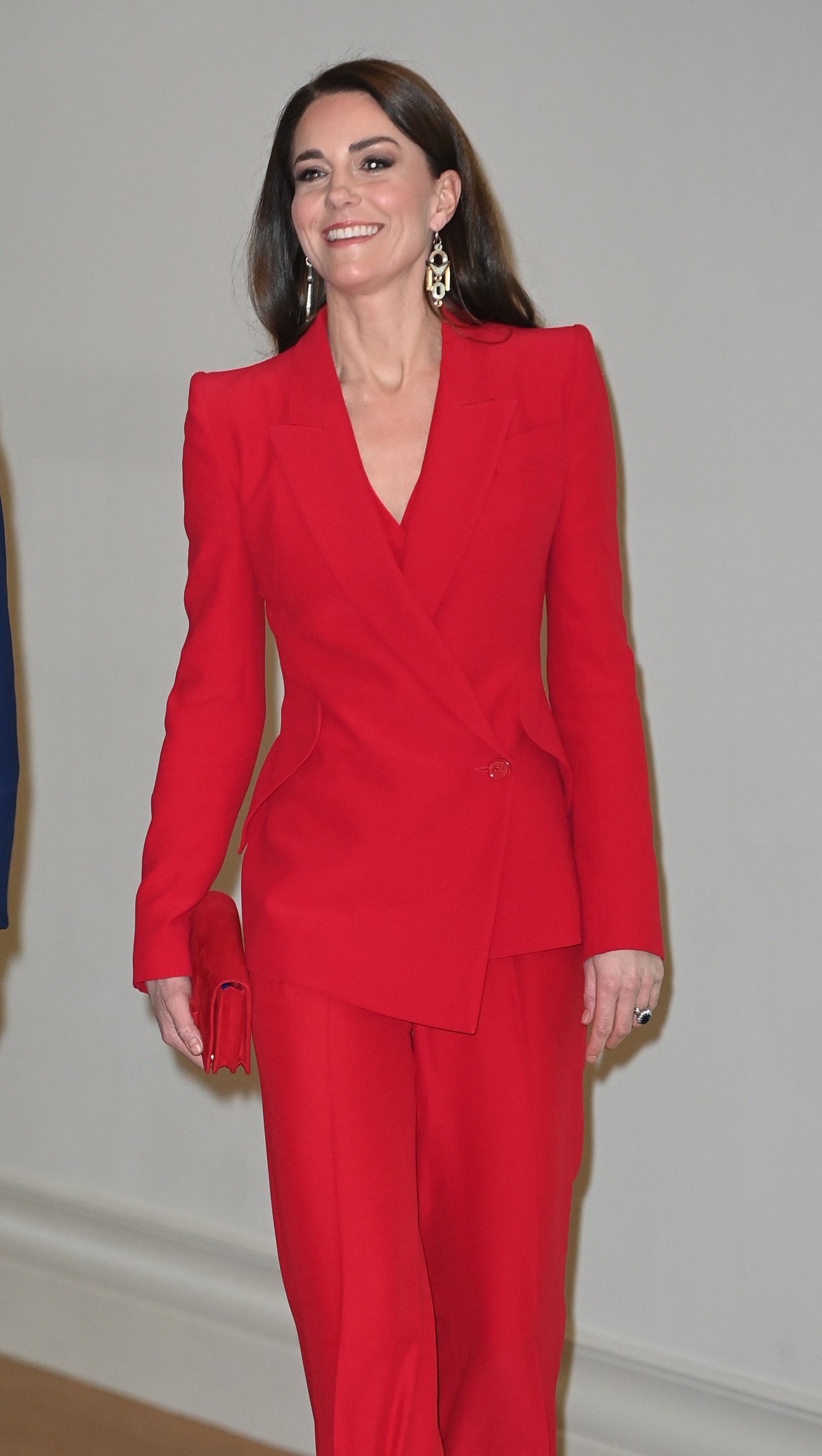 Kate Middleton wearing a red power suits to a pre-campaign launch event, hosted by The Royal Foundation Centre for Early Childhood